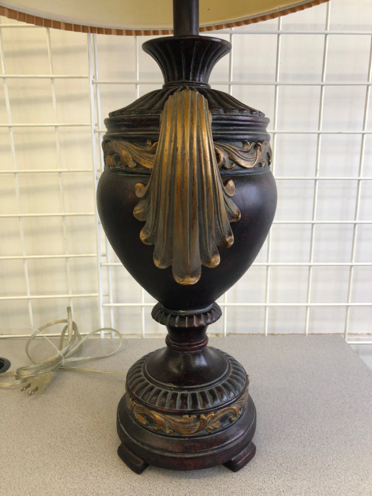 BROWN/GOLD LEAF LAMP BASE W/TAN ACCORDION SHADE.