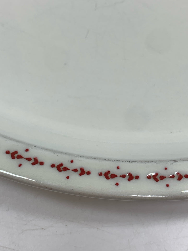 4 WHITE STONEWARE PLATES W/RED DOTTED RIM.