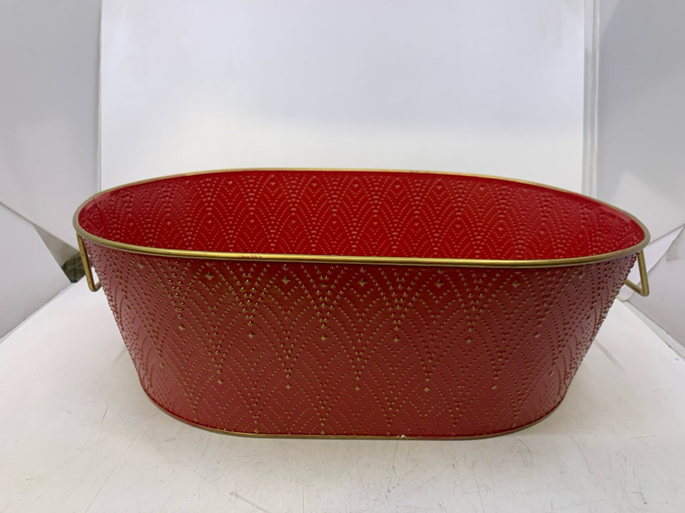 OVAL RED METAL W/ GOLD EMBOSSED DESIGNS.