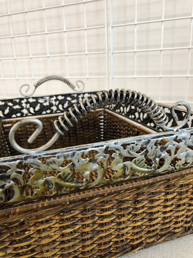 BROWN WOVEN BASKET W/METAL FLORAL RIM AND HANDLES.