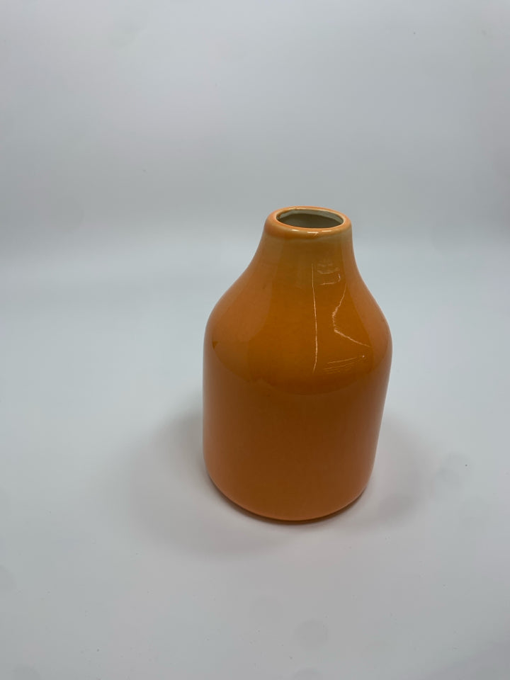 ORANGE CERAMIC BUD VASE.