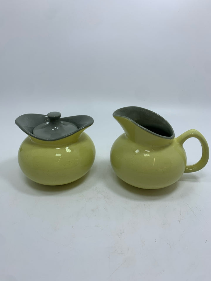 YELLOW CERAMIC CREAMER/SUGAR SET W/GRAY LID.