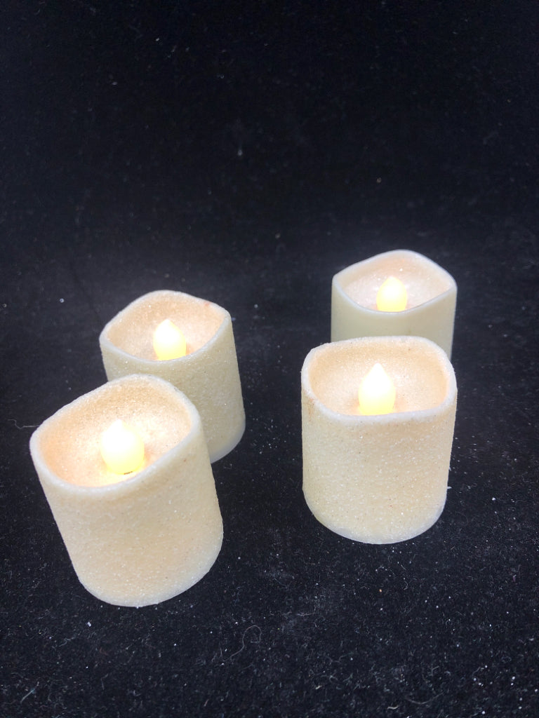 4 GLITTER BATTERY VOTIVES.