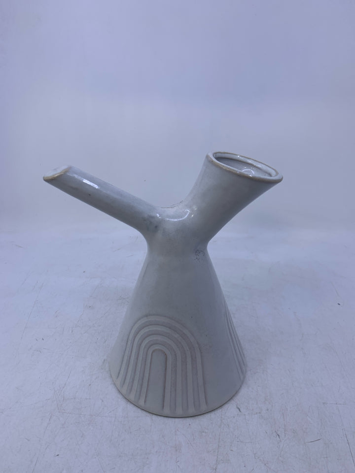 WHITE VASE W/ CARVED ARCHES HANDLE W/ SLATED NECK.