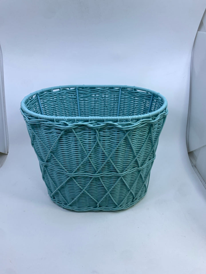 LT BLUE WICKER WASTEBASKET.
