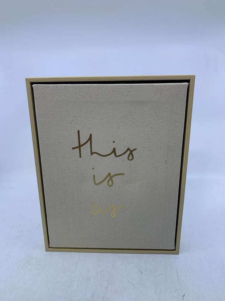 THIS IS US IN GOLD WRITING FRAMED CANVAS.