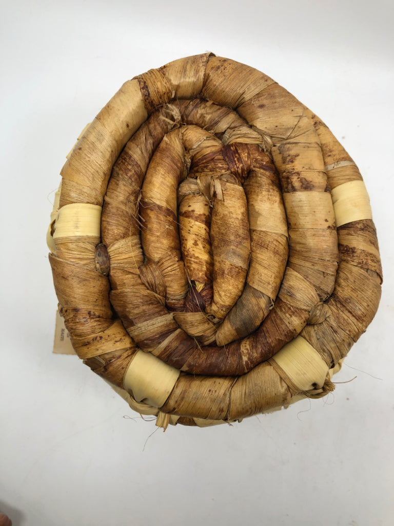 NWT ROUND WOVEN BASKET MADE IN HAITI.
