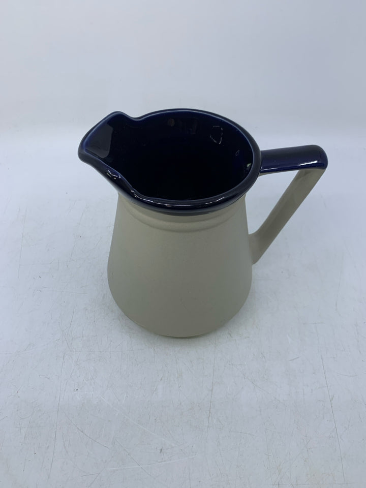 MATTE GRAY PITCHER W/ GLAZED COBALT BLUE INSIDE.