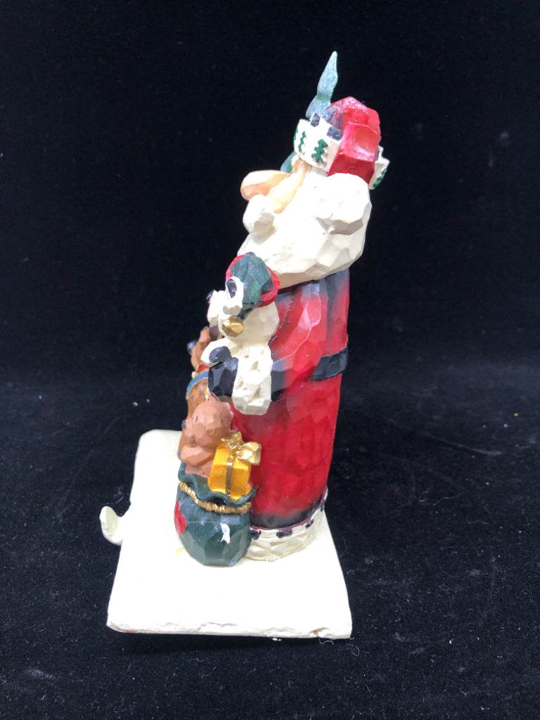 NIB WOOD CARVED SANTA W/PUPPIES STOCKING HOLDER.