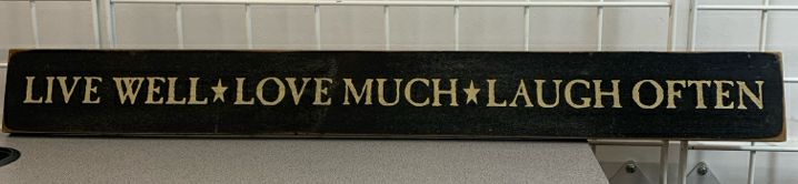 LIVE WELL LAUGH OFTEN PRIMITIVE SIGN.