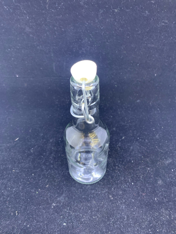 GLASS BOTTLE WITH TOP.