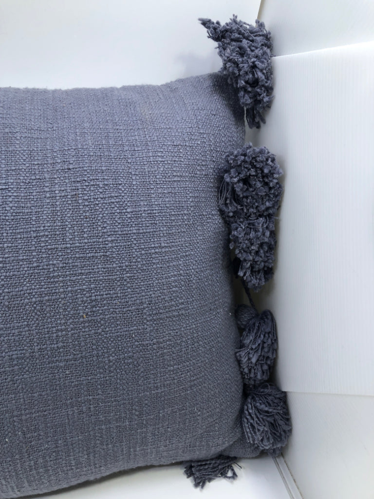 BLUE PILLOW W POM POMS.
