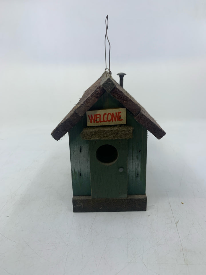 DISTRESSED GREEN CABIN W/ WINDOWS.