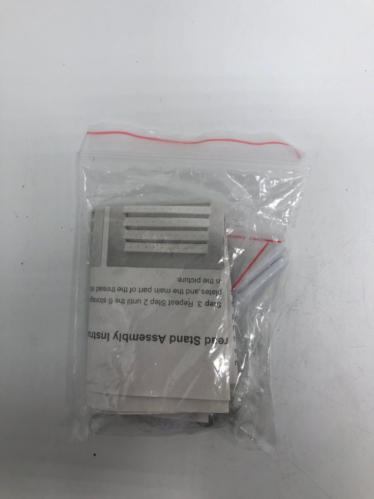 WHITE PLASTIC YARN SPOOL ORGANIZER.