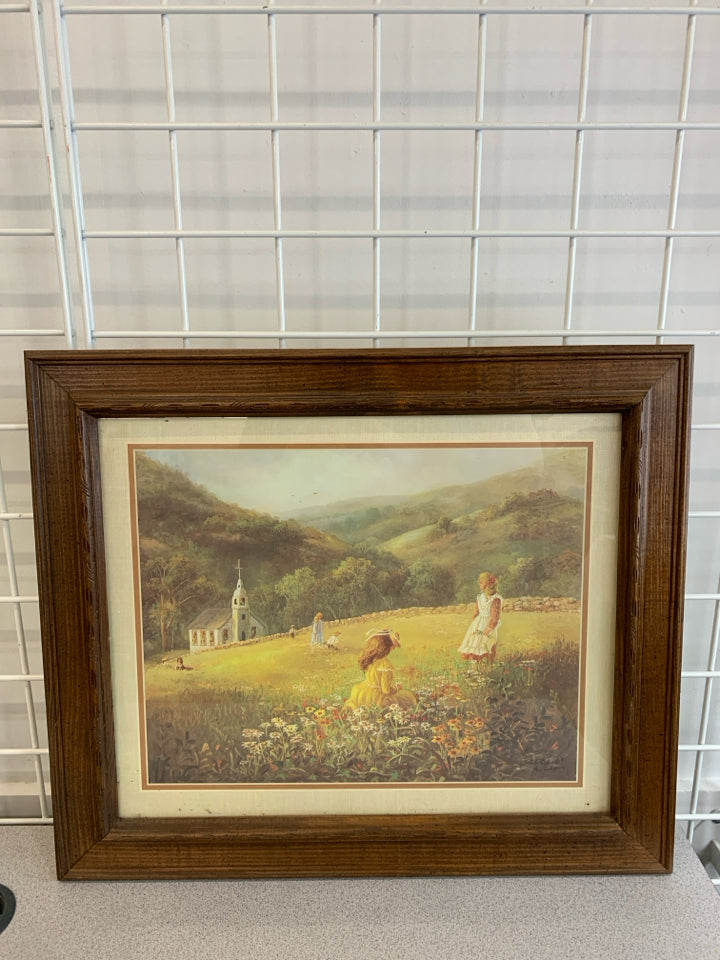 GIRLS IN FIELD PAINTING IN WOOD FRAME.