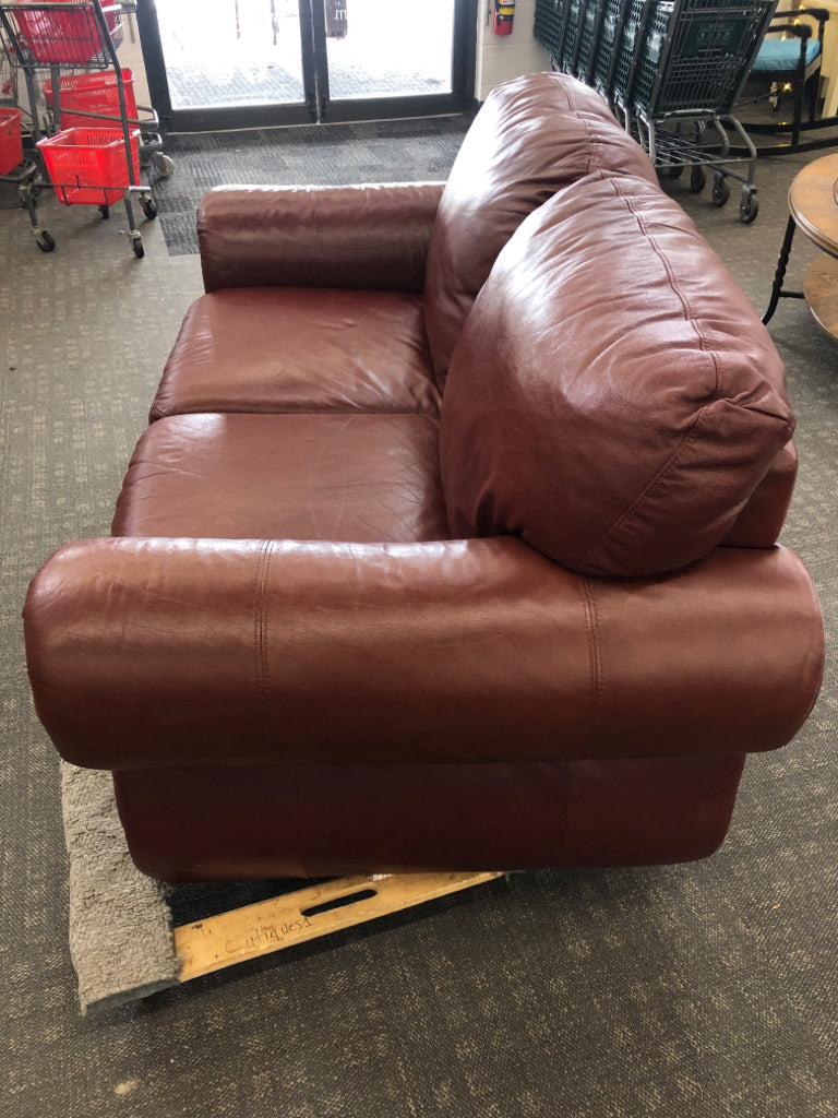 DARK BROWN STUDDED LOVE SEAT.