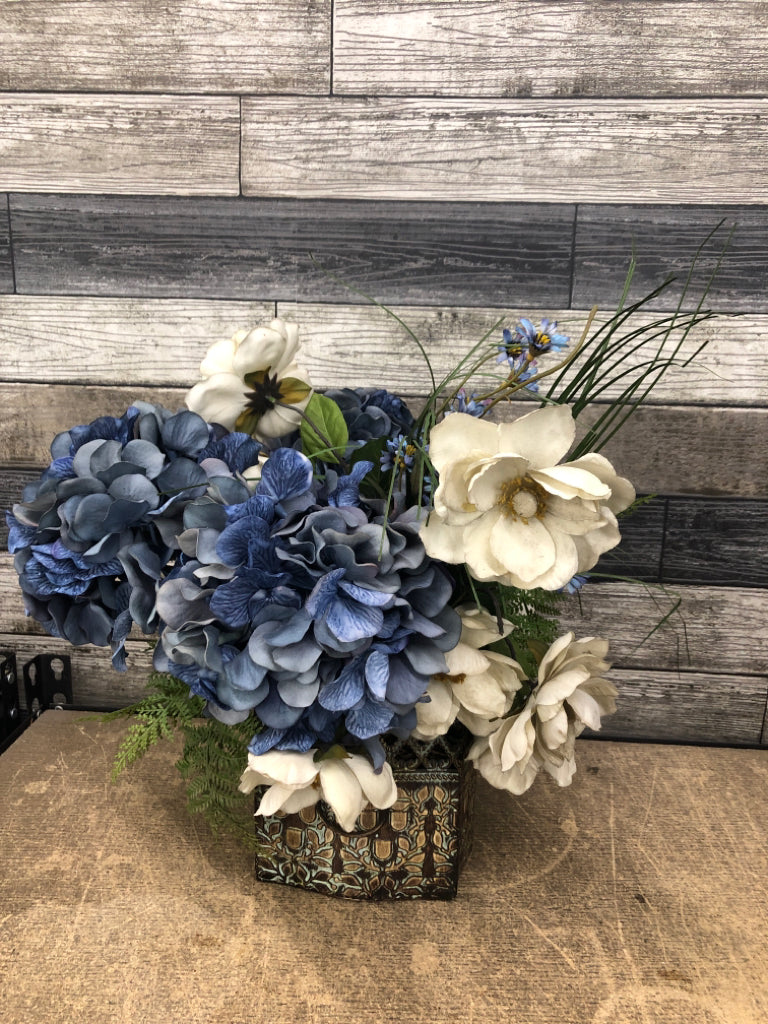 BLUE FLORAL BOUQUET IN DETAILED TIN PLANTER.