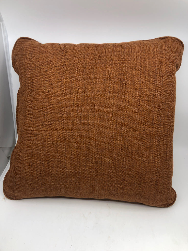 ORANGE AND CREAM ZIGZAG PILLOW.