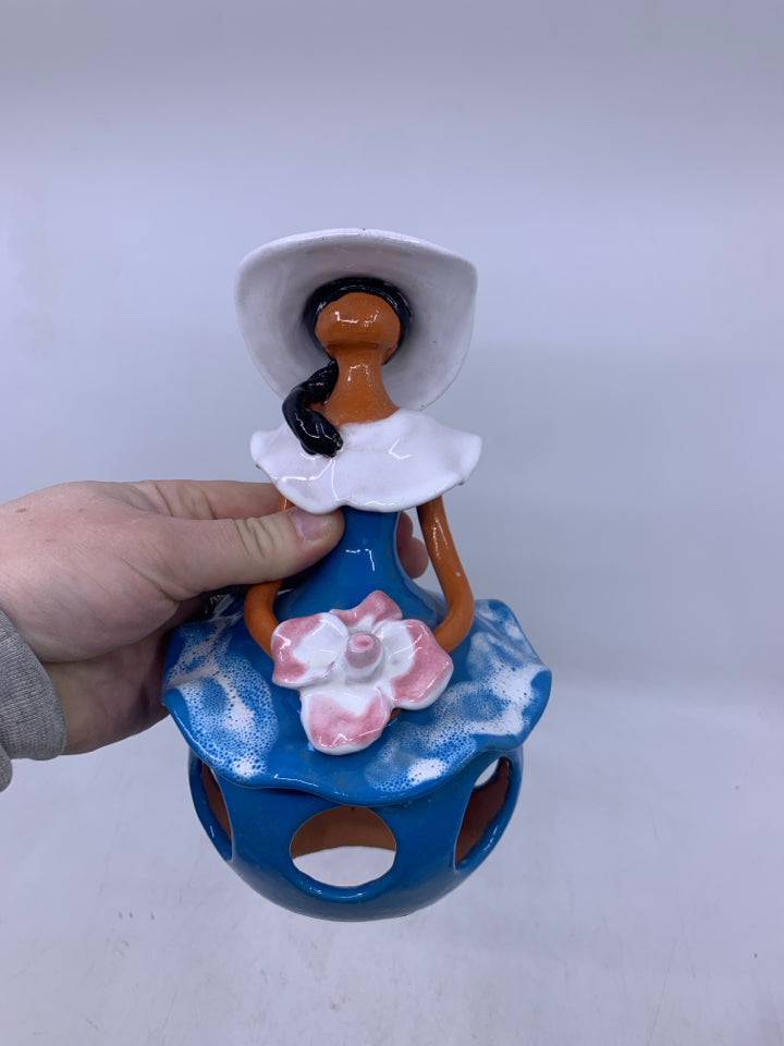 CLAY FACELESS WOMAN W/ BLUE DRESS W/ HOLES + WHITE HAT.
