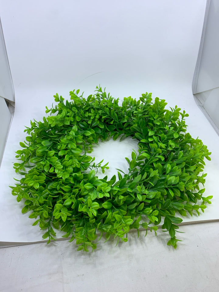 PLASTIC GREENS WREATH.