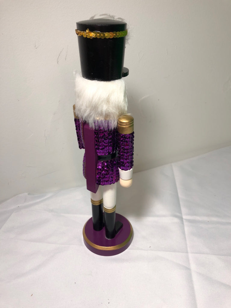 PURPLE SEQUIN NUT CRACKER.