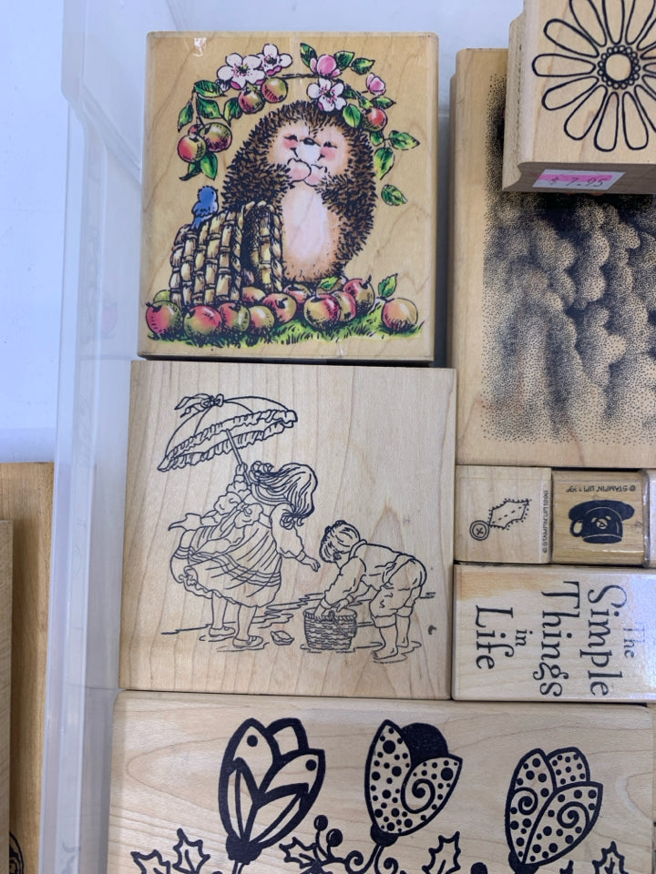 35 ASSORTED STAMPS IN CLEAR PLASTIC CASE.