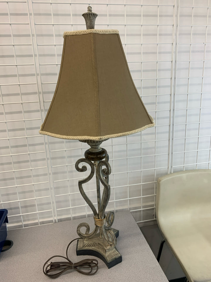 SILVER SCROLL BASE LAMP W/BROWN EMBROIDERED EDGE SHADE.