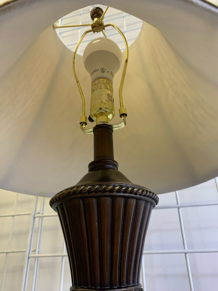 BROWN WOOD GOLD SWIRL TABLE LAMP WITH GOLD SWIRL SHADE.