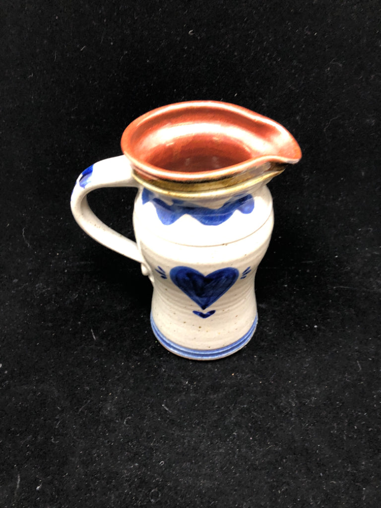 PRIMITIVE STONEWARE PITCHER WITH HEART.