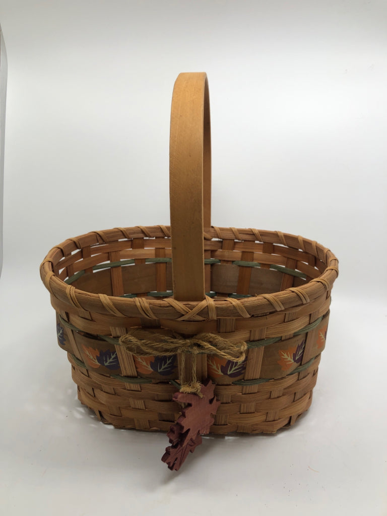 WOVEN BASKET W/WOOD LEAVES AND HANDLE.