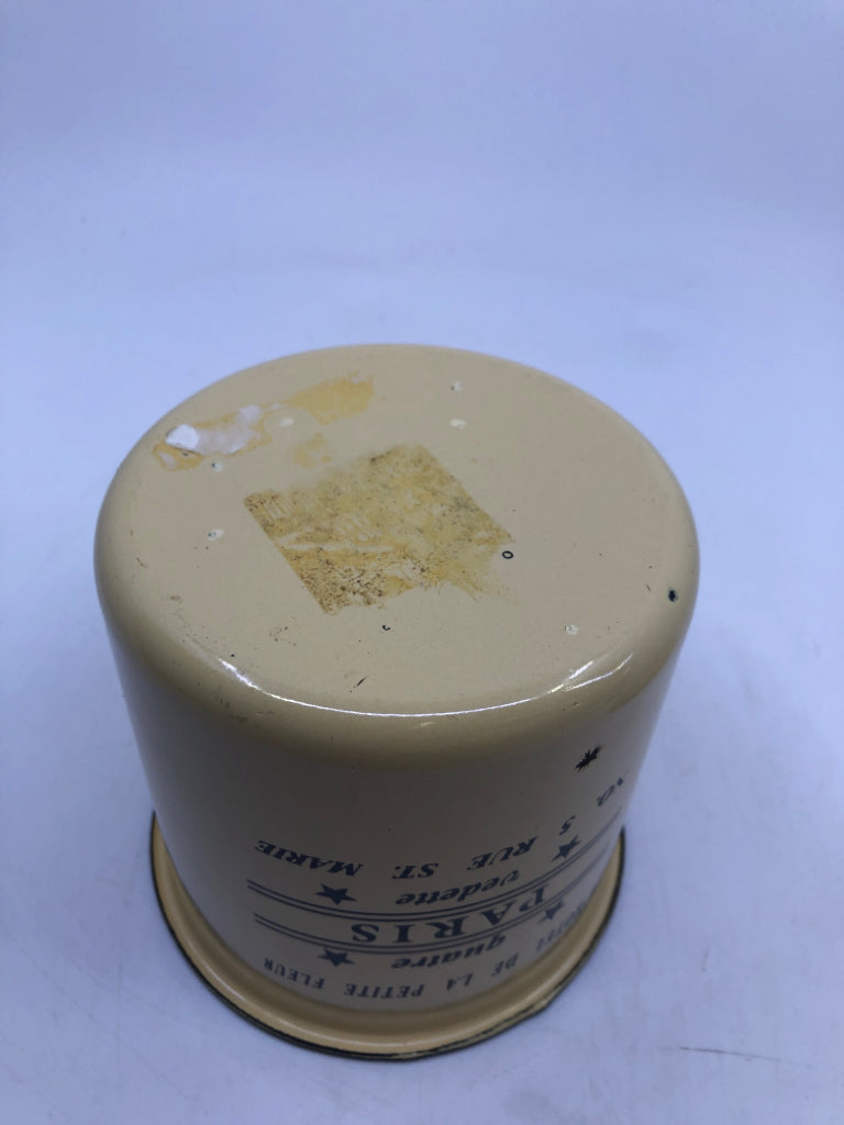 CREAM METAL CANISTER W/ QUATRE PARIS PRINTED.