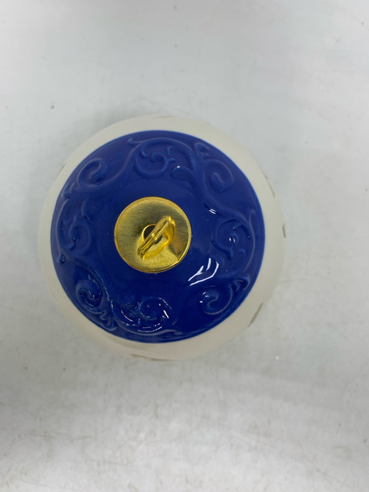 CIRCLE PIERCED LIGHT UP CERAMIC ORNAMENT.