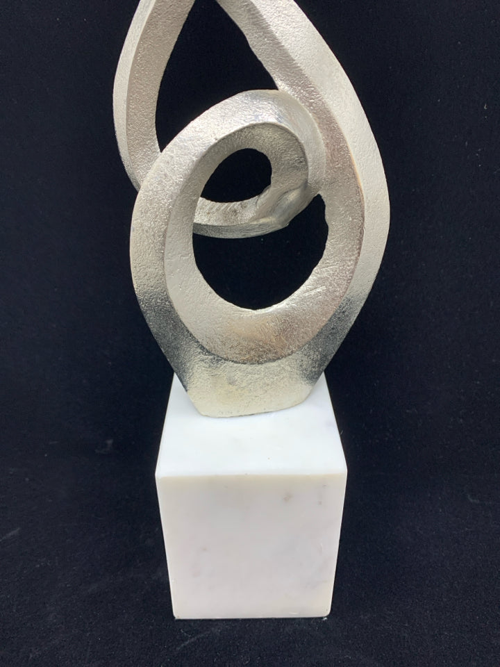 ABSTRACT METAL SCULPTURE ON MARBLE BASE.