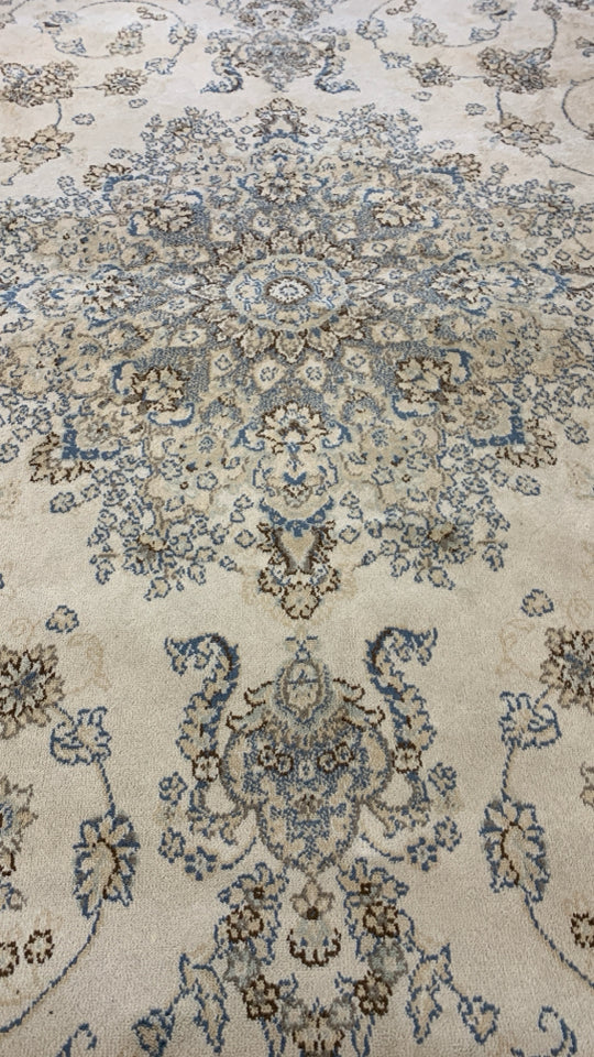 CREAM AREA RUG W/ BLUE,BROWN,GREY PAISLEY DESIGN EDEN.