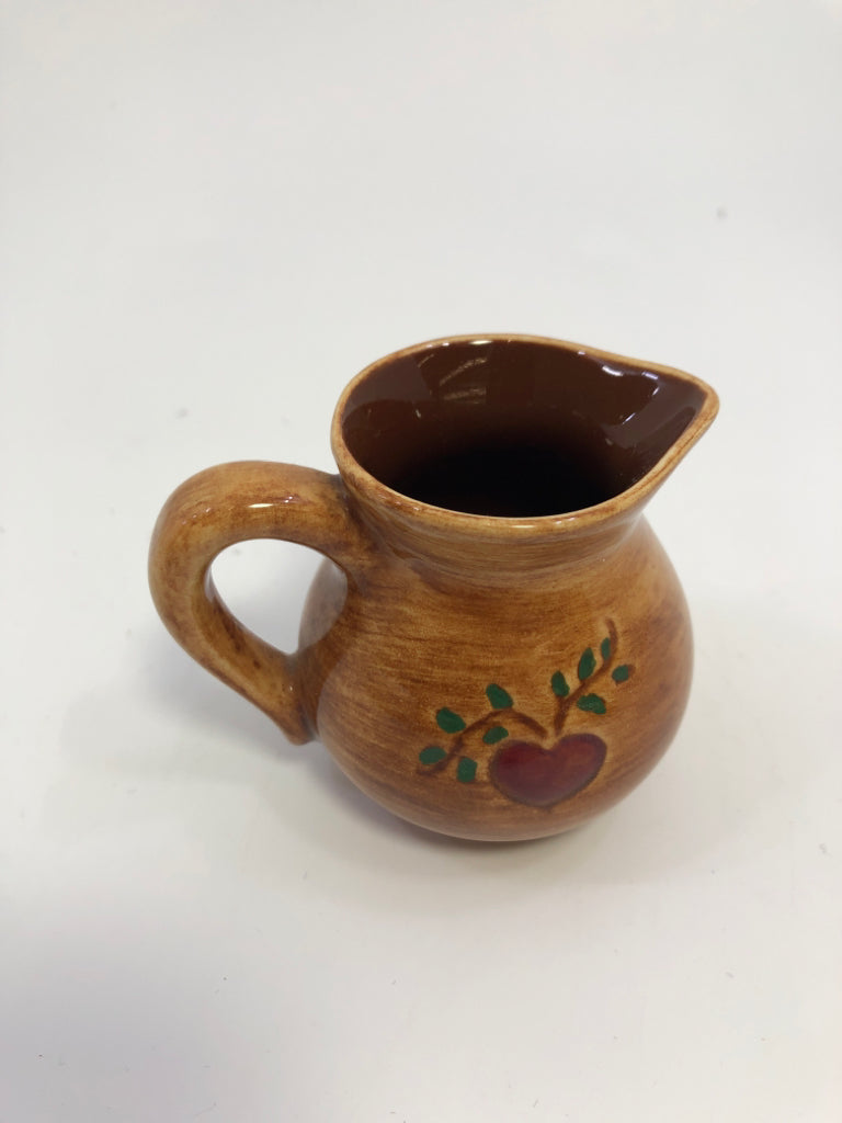 MINI BROWN PITCHER W/PAINTED WOMAN.