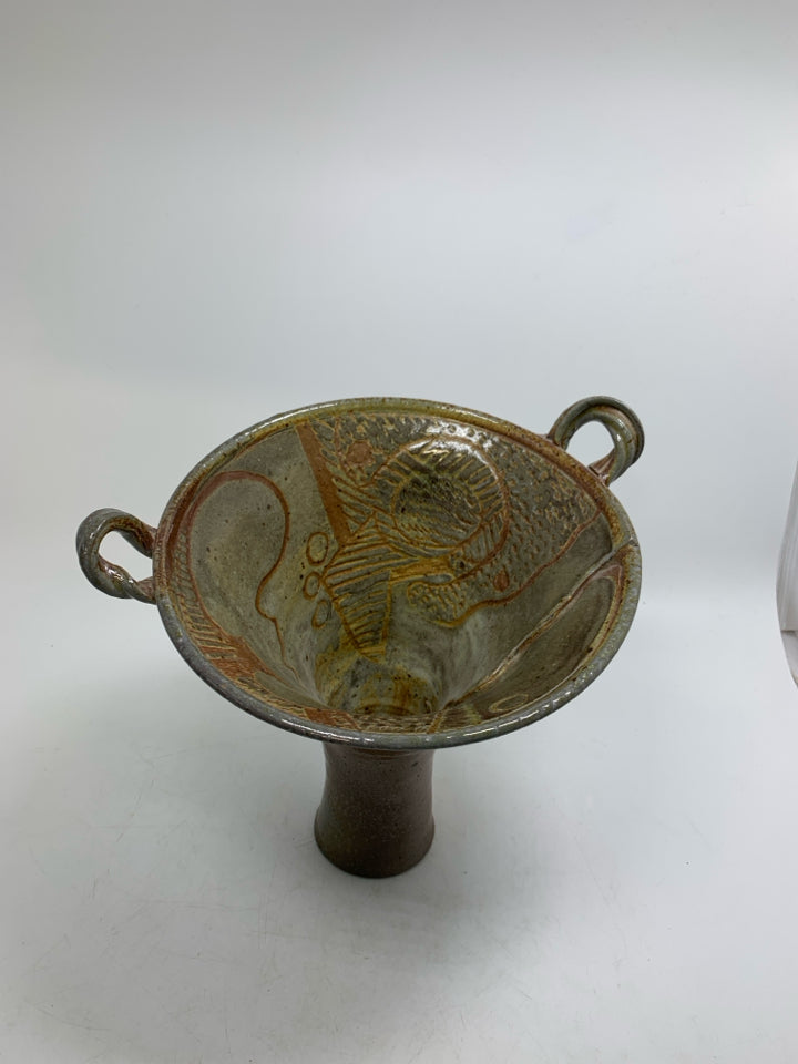 ABSTRACT VASE W/ CARVING INSIDE FLARED TOP AND SMALL HANDLES.