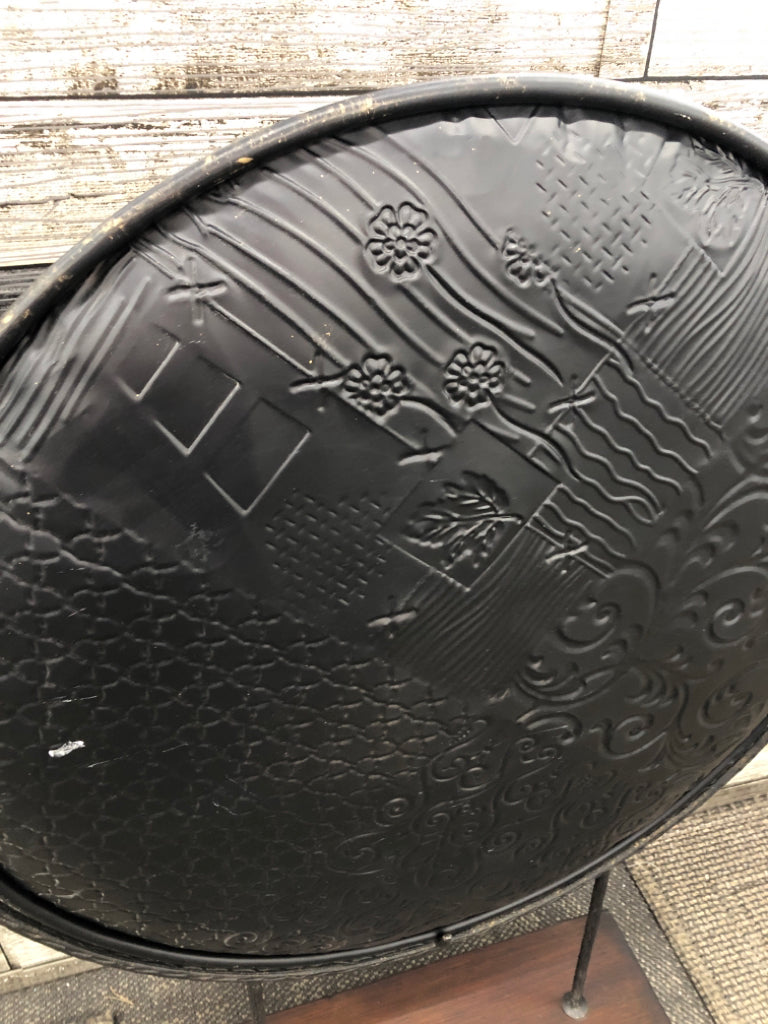 LEAF EMBOSSED ROUND METAL CENTERPIECE ON WOOD STAND.