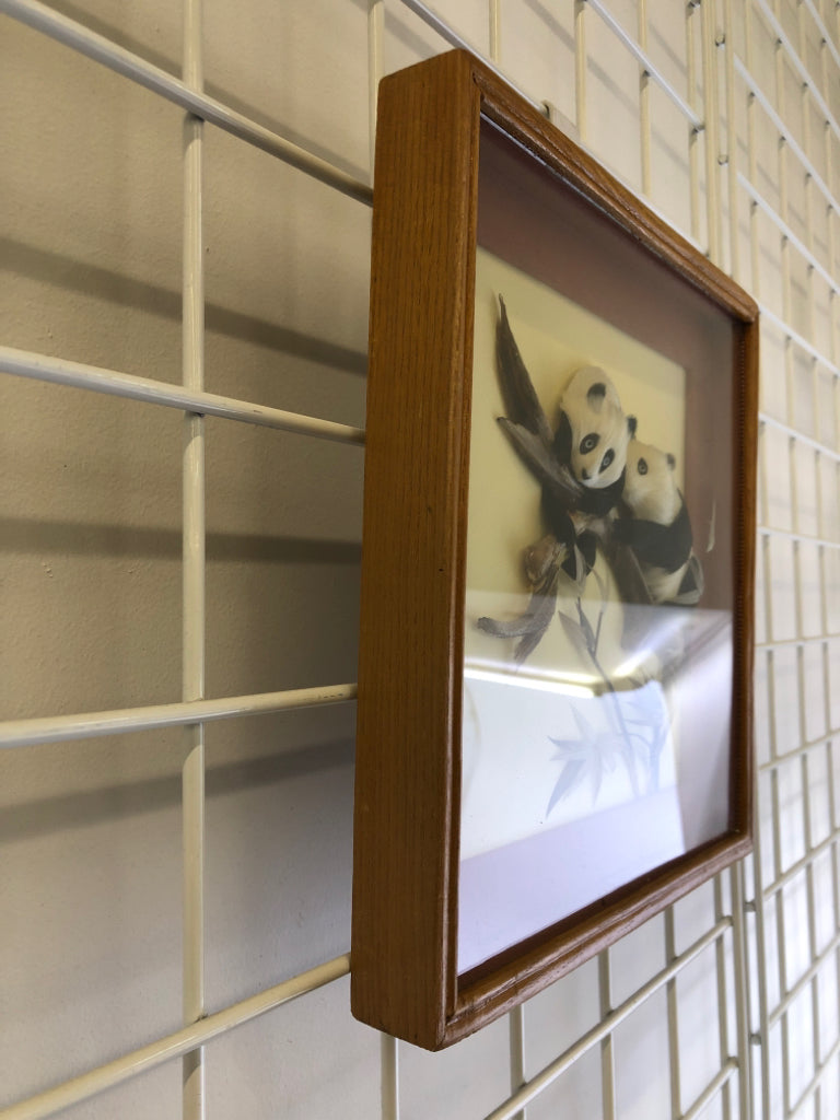 SHADOW BOX W/ FEATHERED PANDAS IN BRANCH.