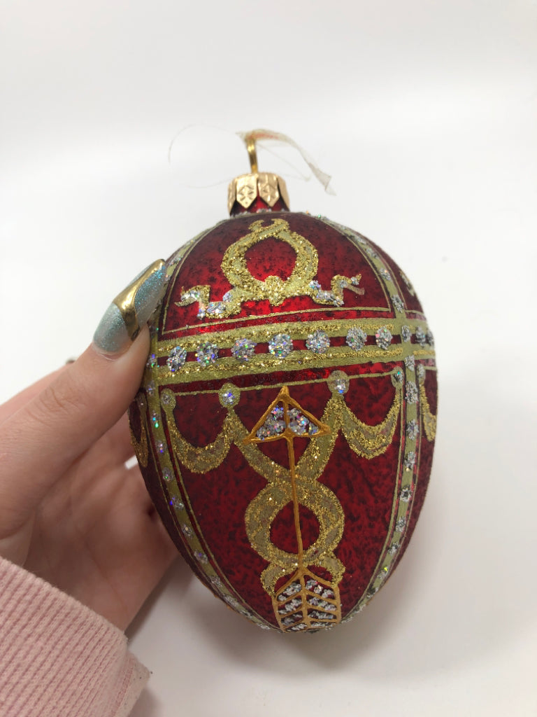 RED & GOLD EGG SHAPED ORNAMENT.