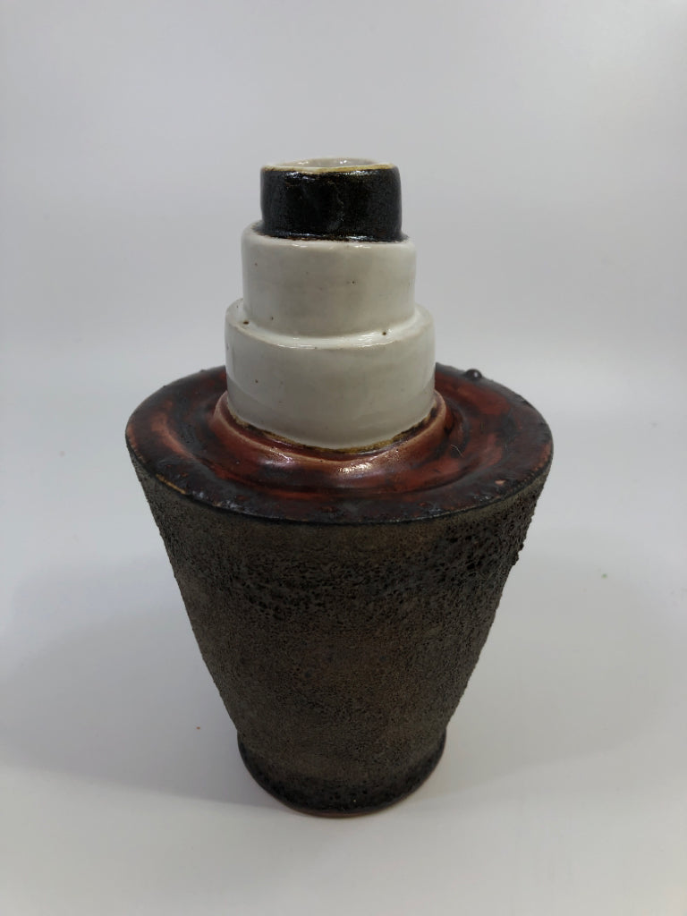 ROUGHED CERAMIC VASE W/RED & WHITE LAYERS.