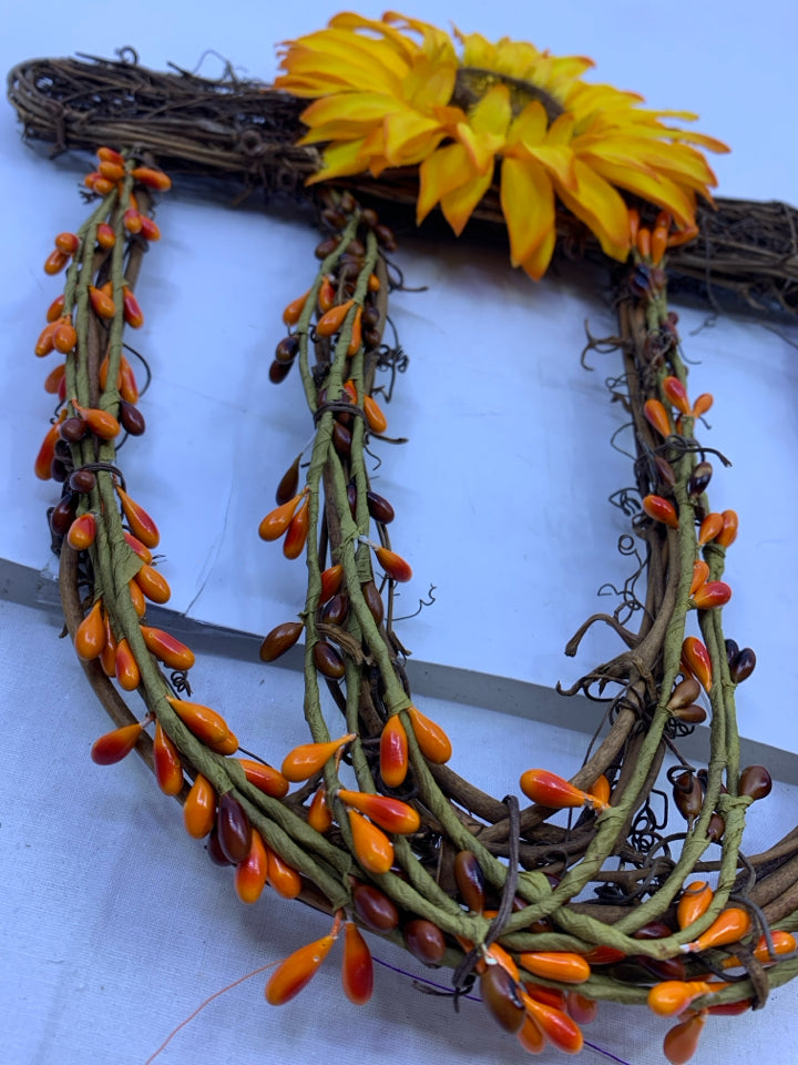 TWIG ACORN WITH SUNFLOWER WALL HANGING.