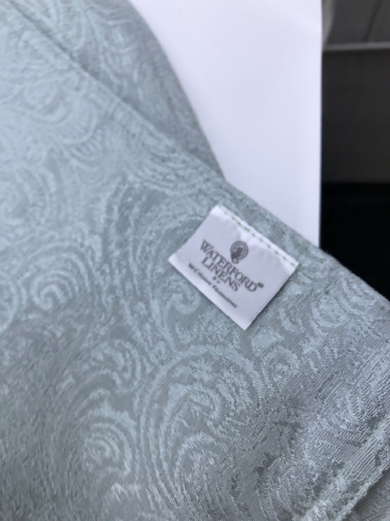 4 LIGHT BLUE WATERFORD PLACE MATS W PAISLEY PATTERN.