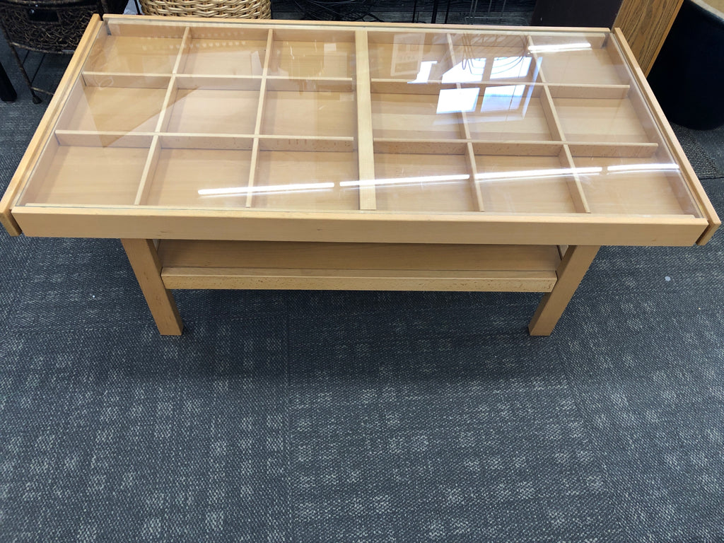 WOOD COFFEE TABLE W/ 18 SLIDE-OUT SLOTS & GLASS COVER.