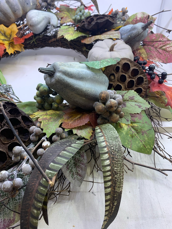 BLUE FAUX FLORAL TWIG WREATH.