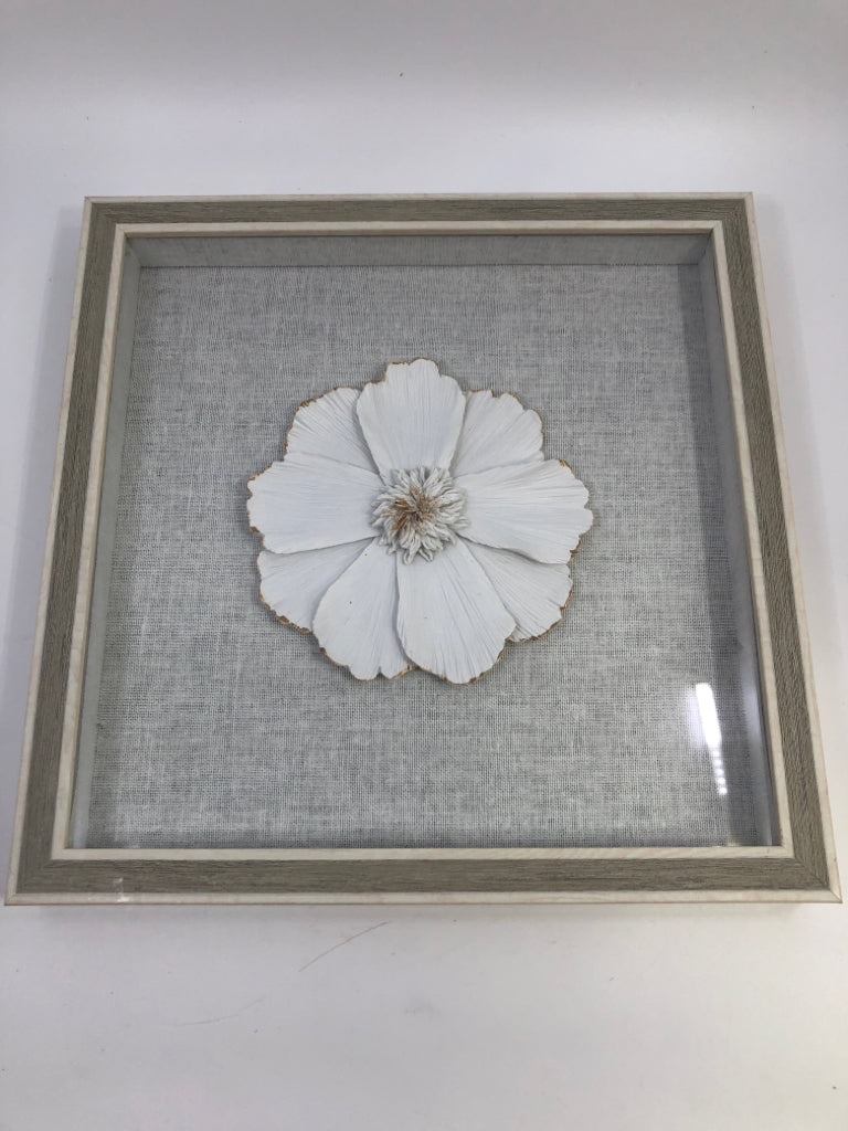WHITE FLOWER IN GREY SHADOWBOX FRAME.