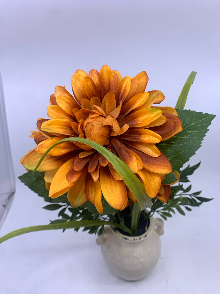 ORANGE FLORAL IN CREAM VASE.