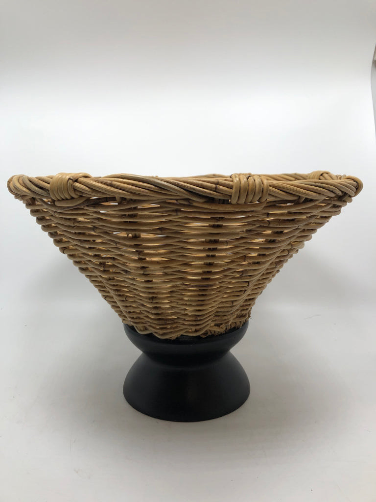 WOVEN BASKET ON BLACK METAL PEDESTAL.