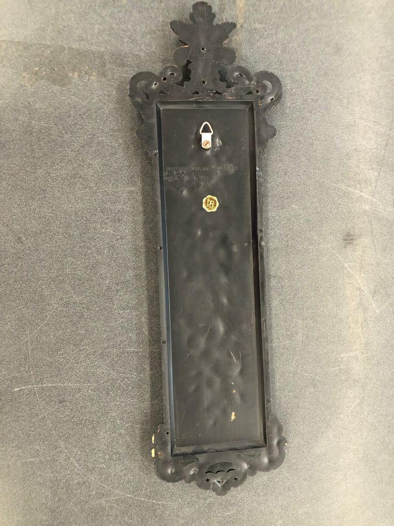 VTG BLACK W BRONZE FLORAL WALL HANGING.