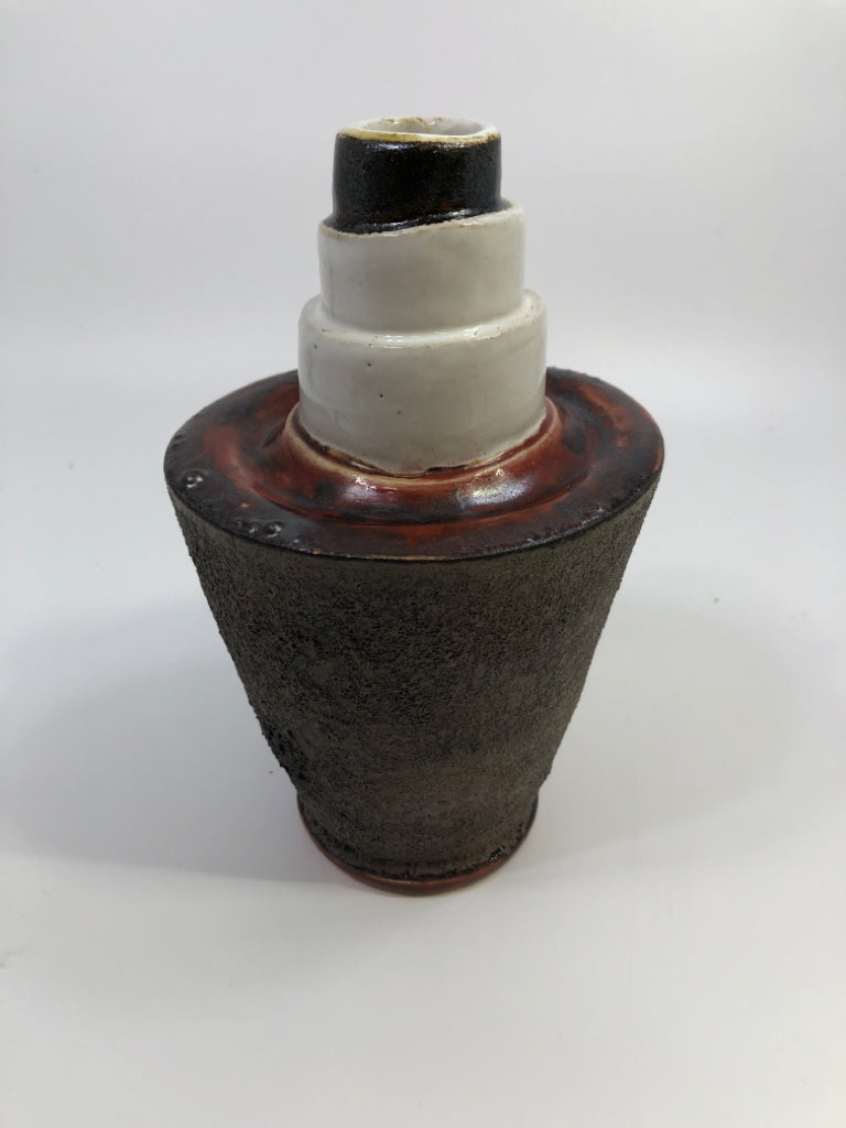 ROUGHED CERAMIC VASE W/RED & WHITE LAYERS.