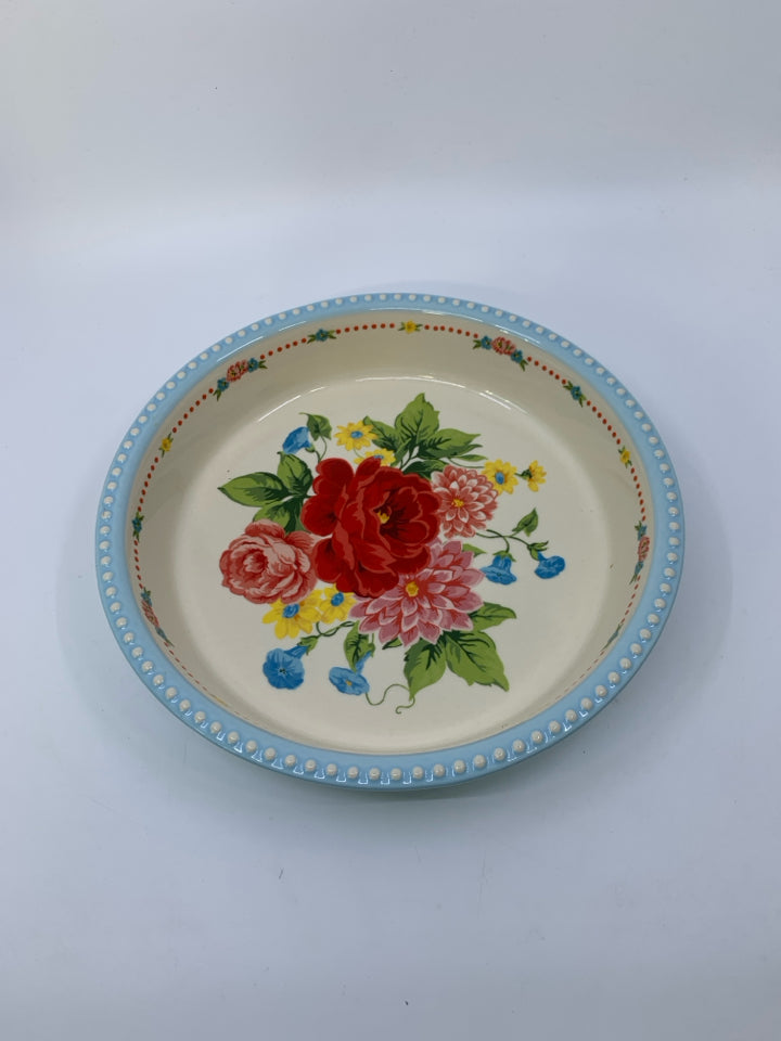 FLORAL BOUQUET IN CENTER W/ LIGHT BLUE BEADED EGE PIE DISH.
